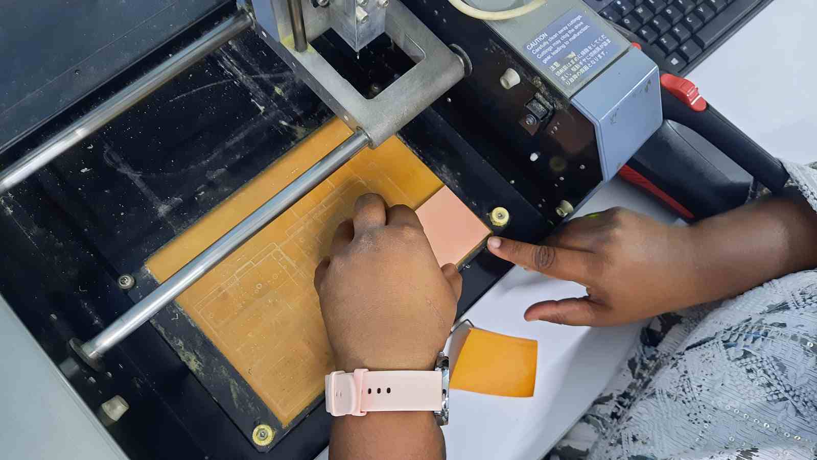 Stick the board onto thin double sided tape